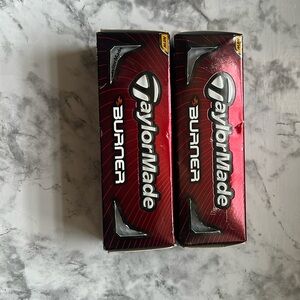 Two packs of 3 golf balls